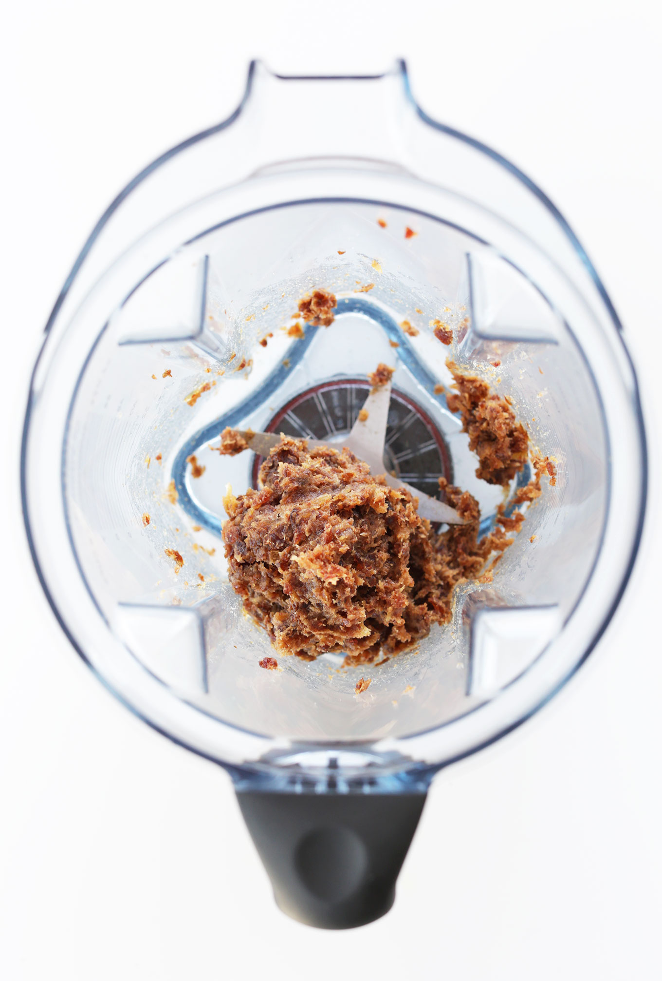Blender with freshly blended dates for making energy bites
