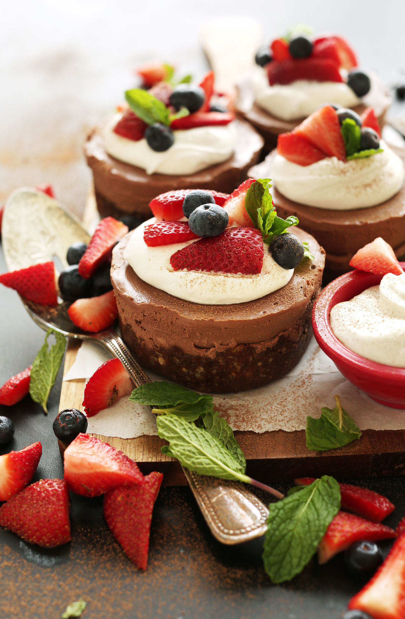 Cutting board filled with simple homemade Vegan Chocolate Cheesecakes