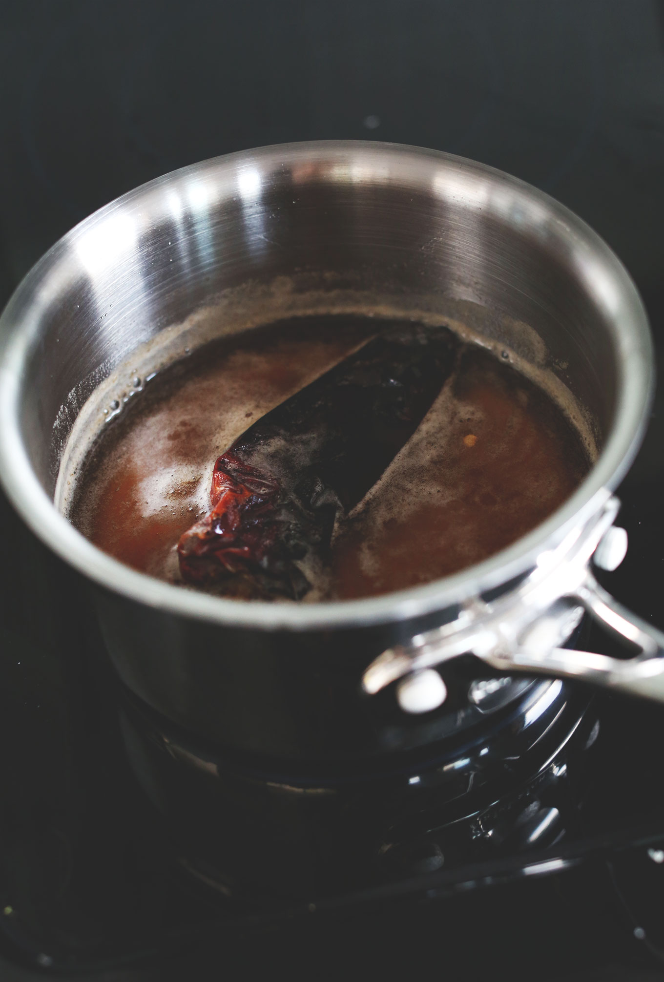 Making Cinnamon Chili Simple Syrup in a saucepan