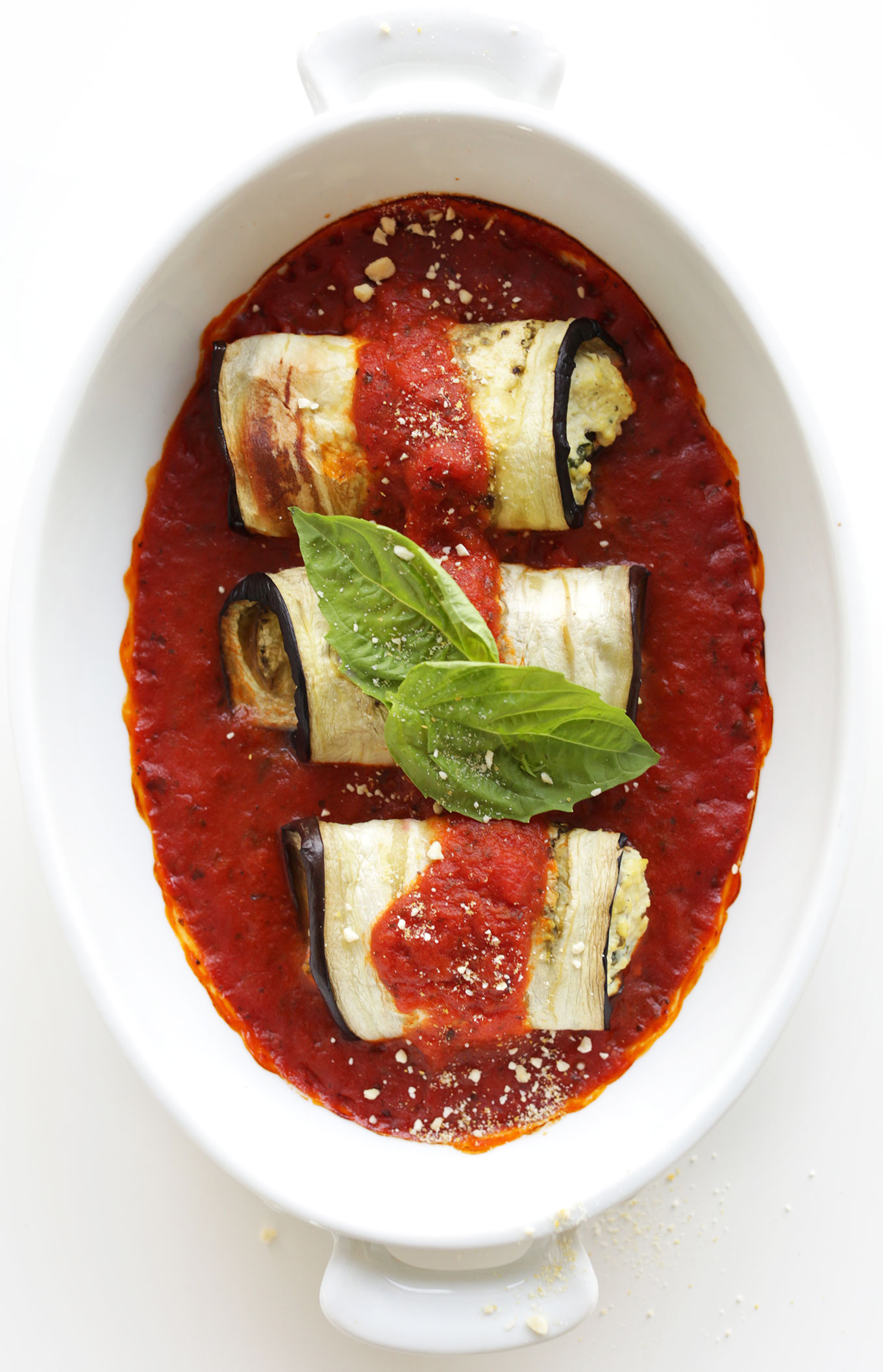 Baking dish filled with Eggplant Lasagna Roll Ups for a satisfying gluten-free vegan meal