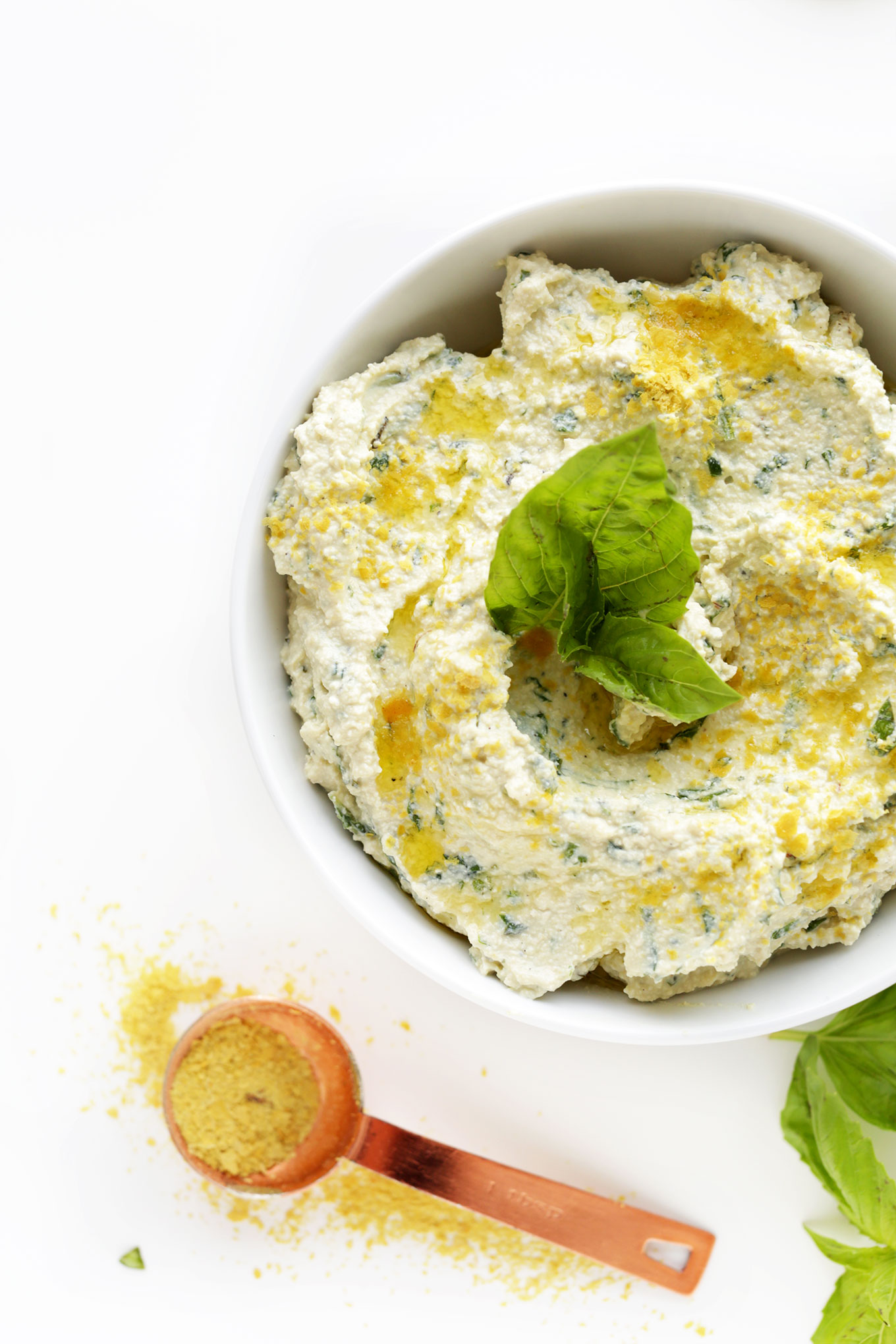 Bowl of our delicious Tofu Ricotta Recipe with fresh herbs and lemon