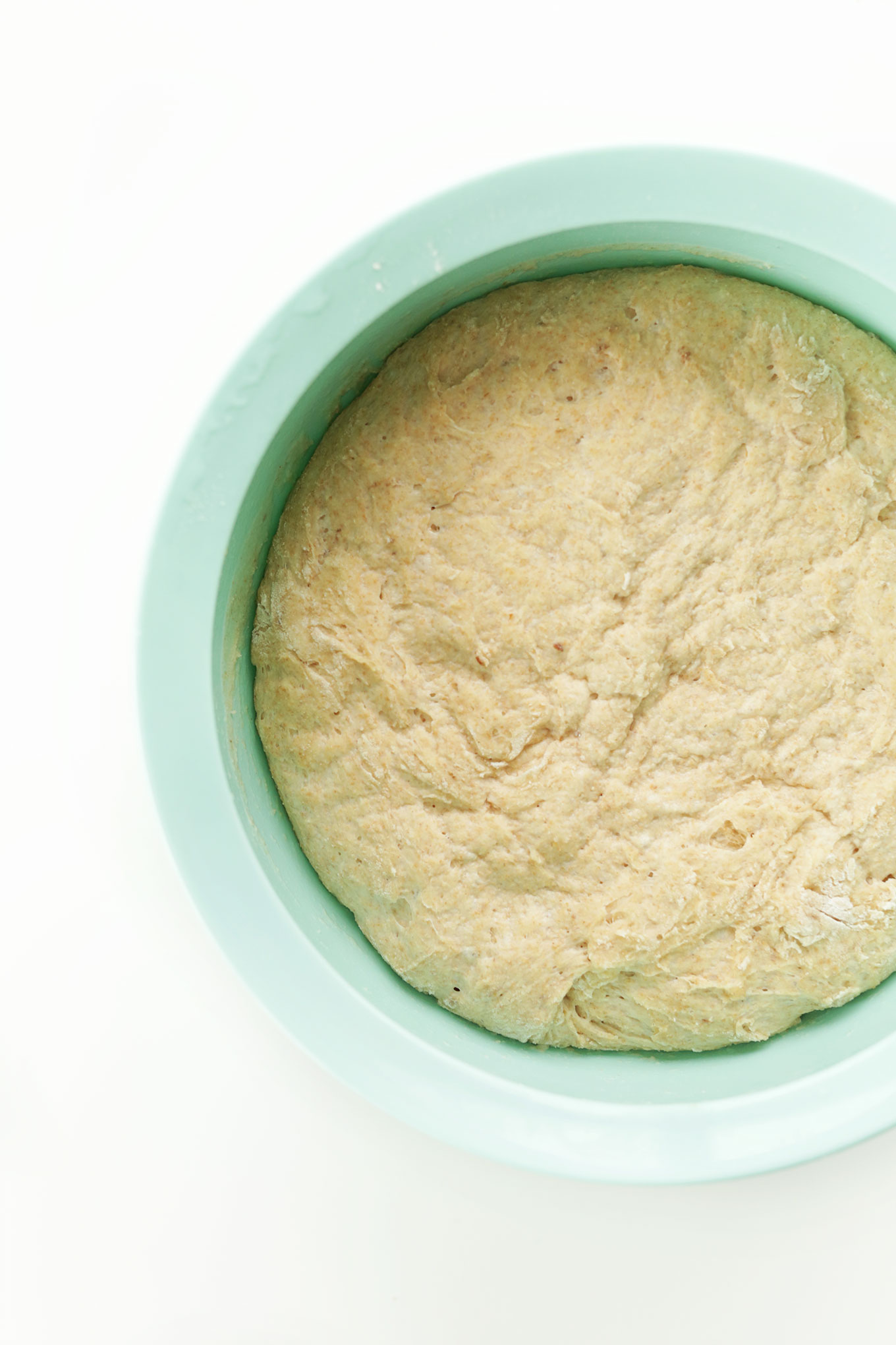 Bread dough rising in a mixing bowl