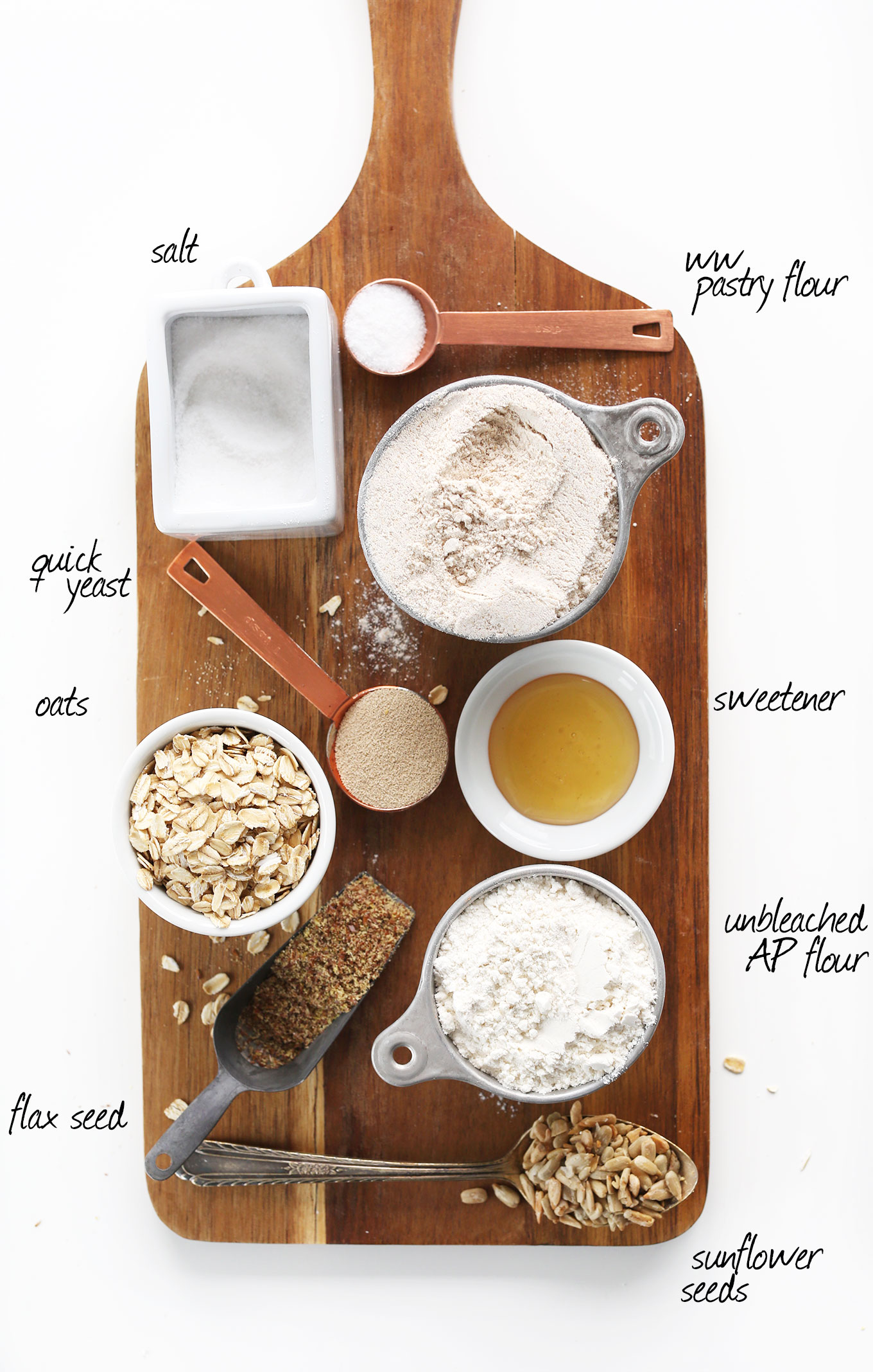 Wood platter with ingredients for making super simple homemade vegan bread