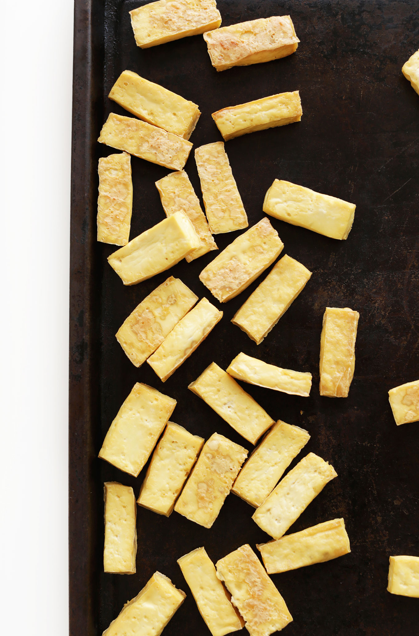 Baking sheet with sliced tofu for making Bahn Mi Spring Rolls