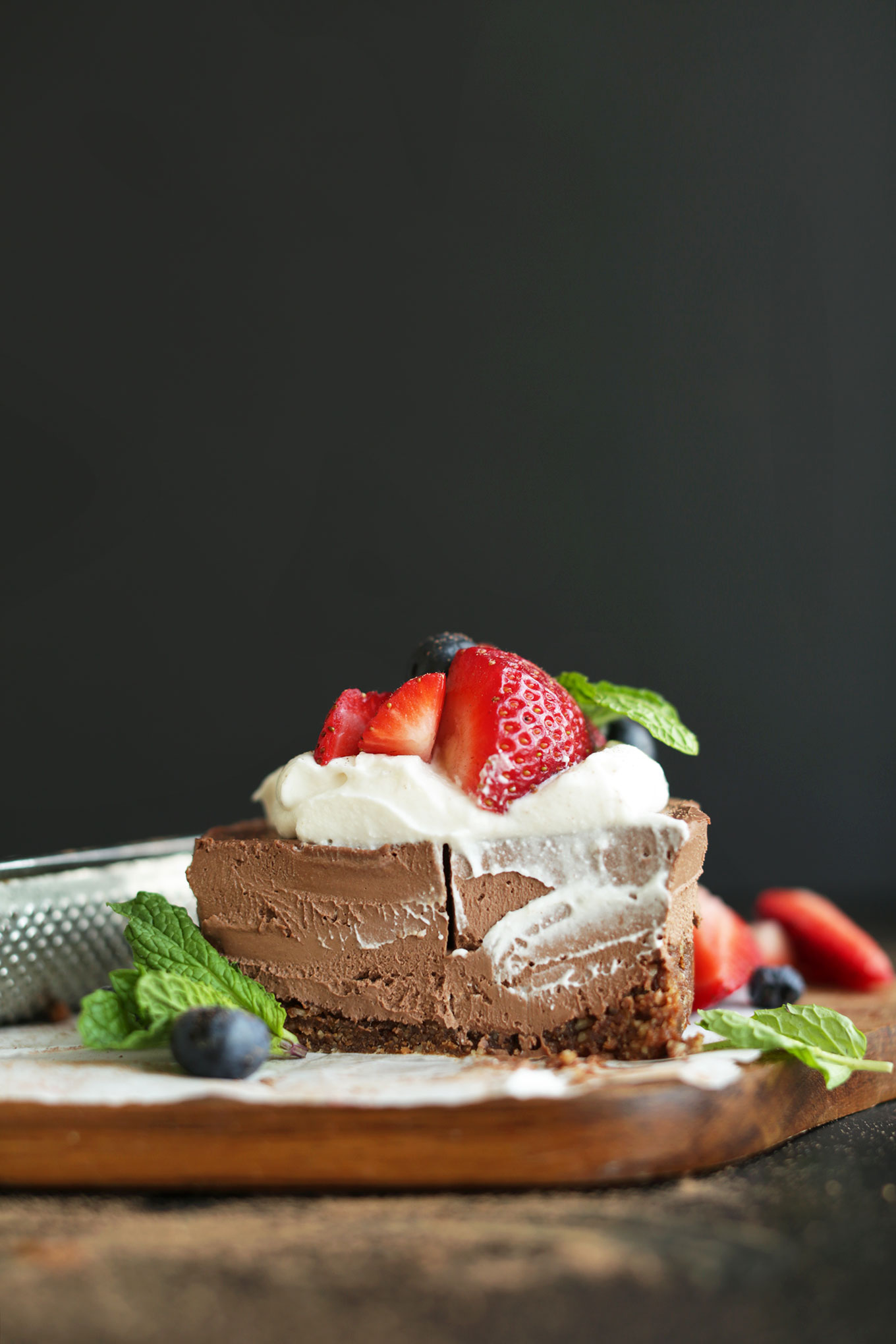 Halved mini Vegan Chocolate Cheesecake revealing its creamy texture