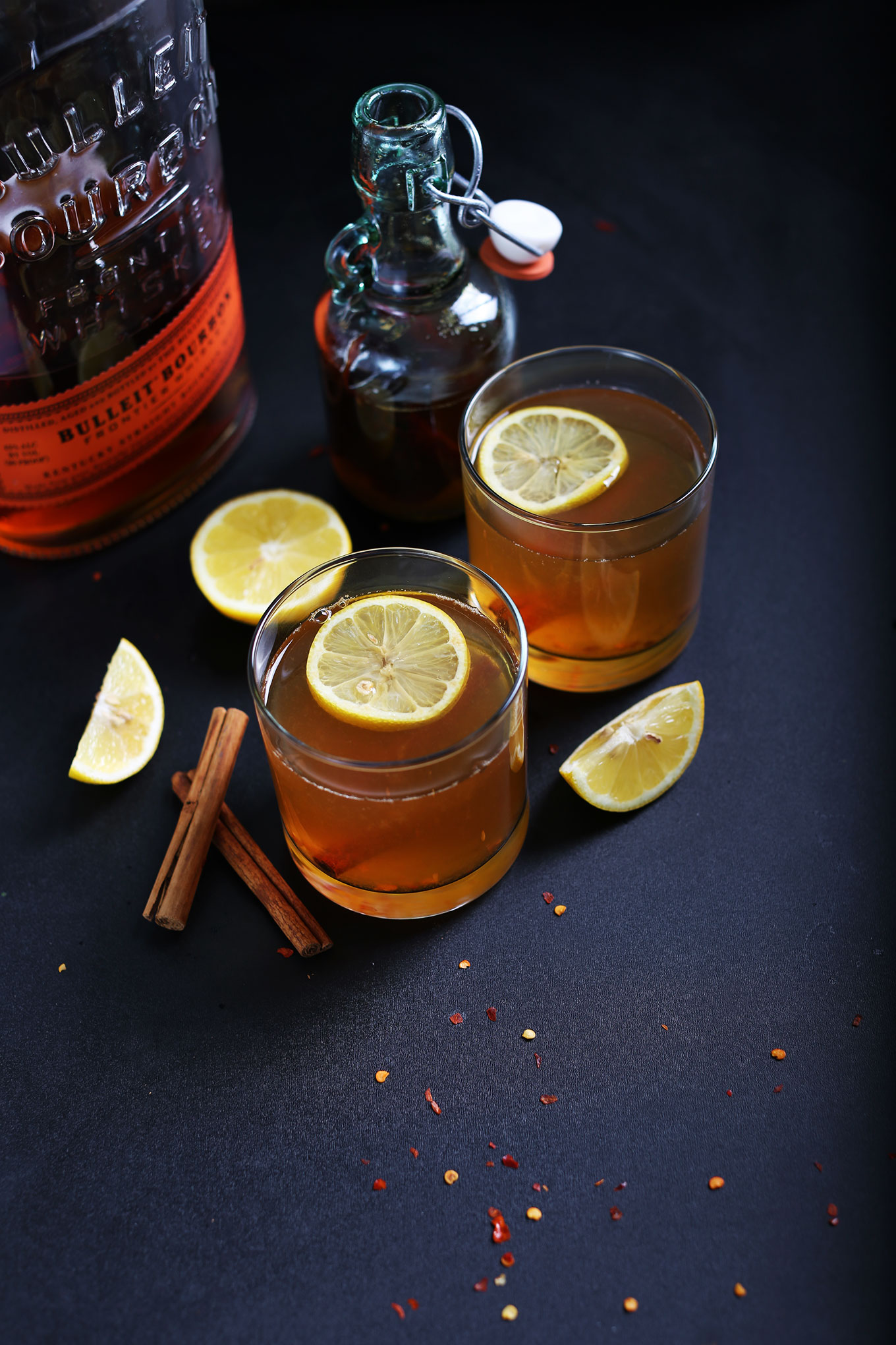 Glasses of our Chili Cinnamon Hot Toddy recipe with lemon slices