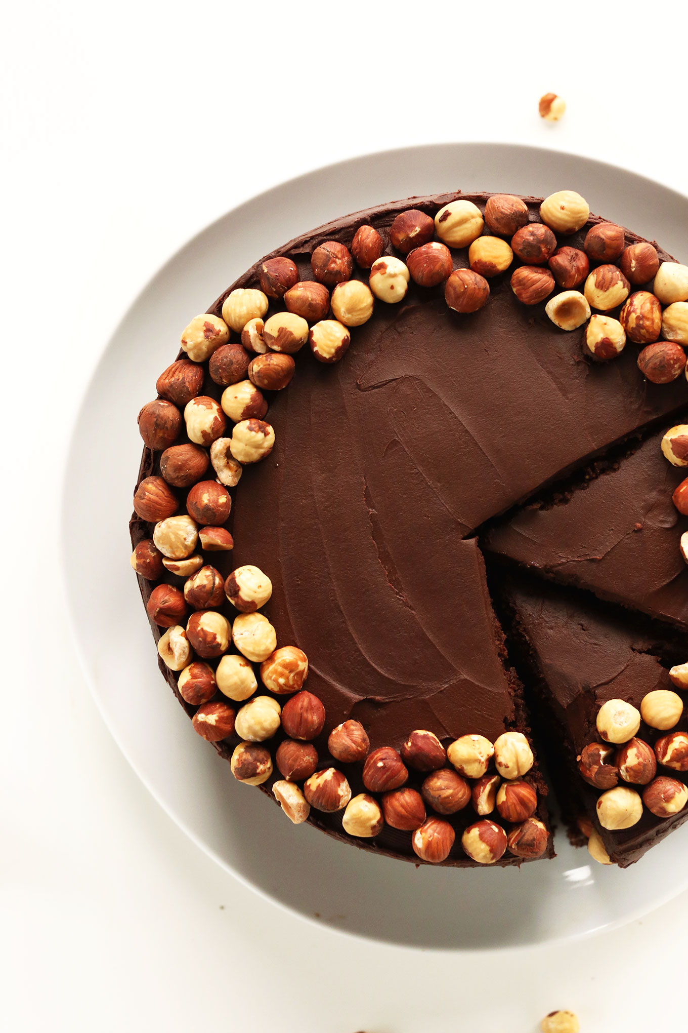 Partially sliced gluten-free vegan Chocolate Hazelnut Cake