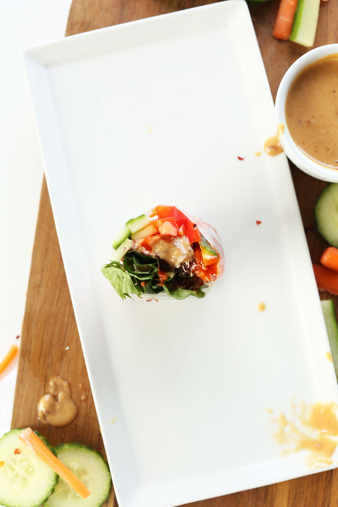 Quinoa Spring Roll cut open to reveal the fresh and colorful vegetables inside