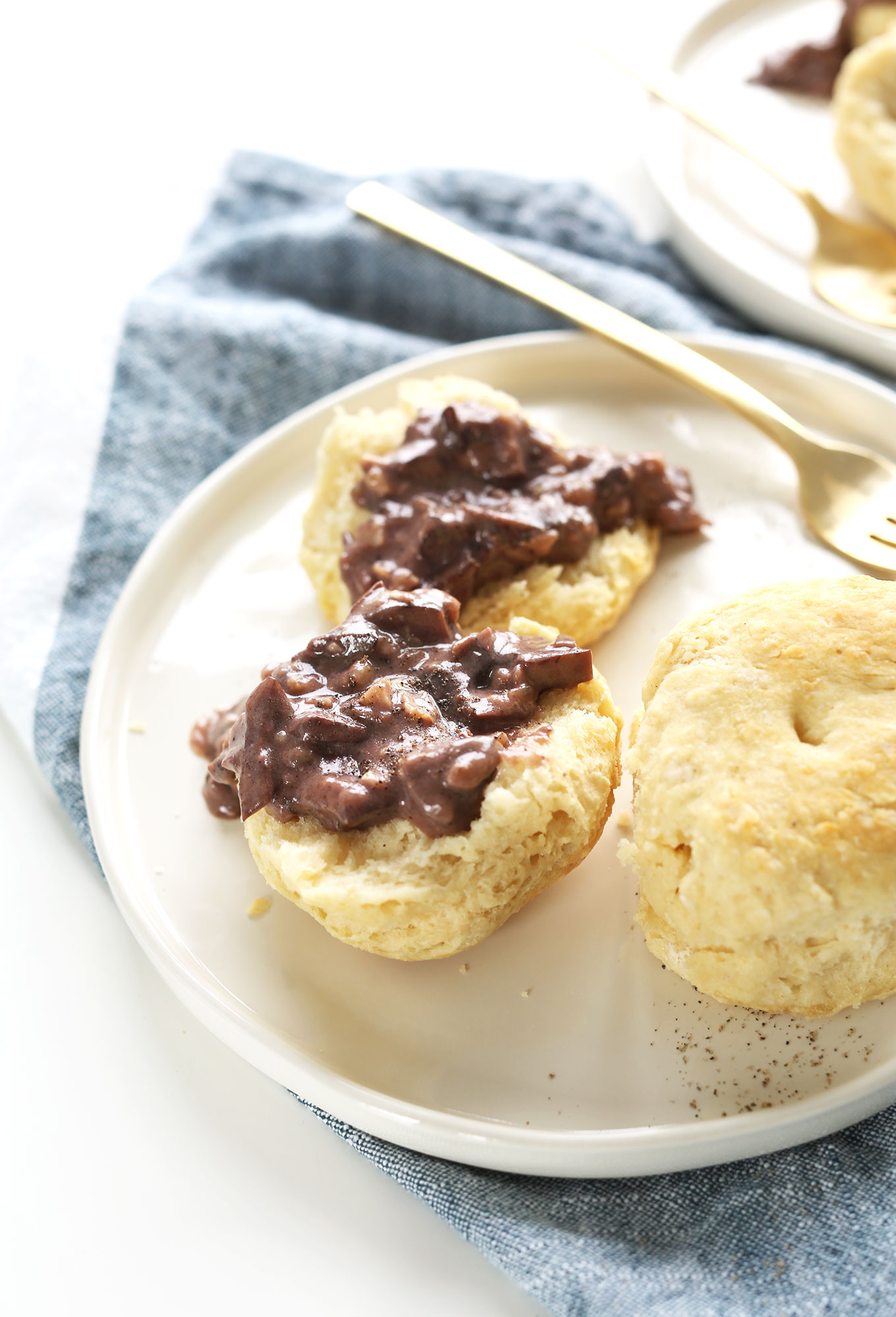 Plate of our flaky vegan biscuits and gravy recipe