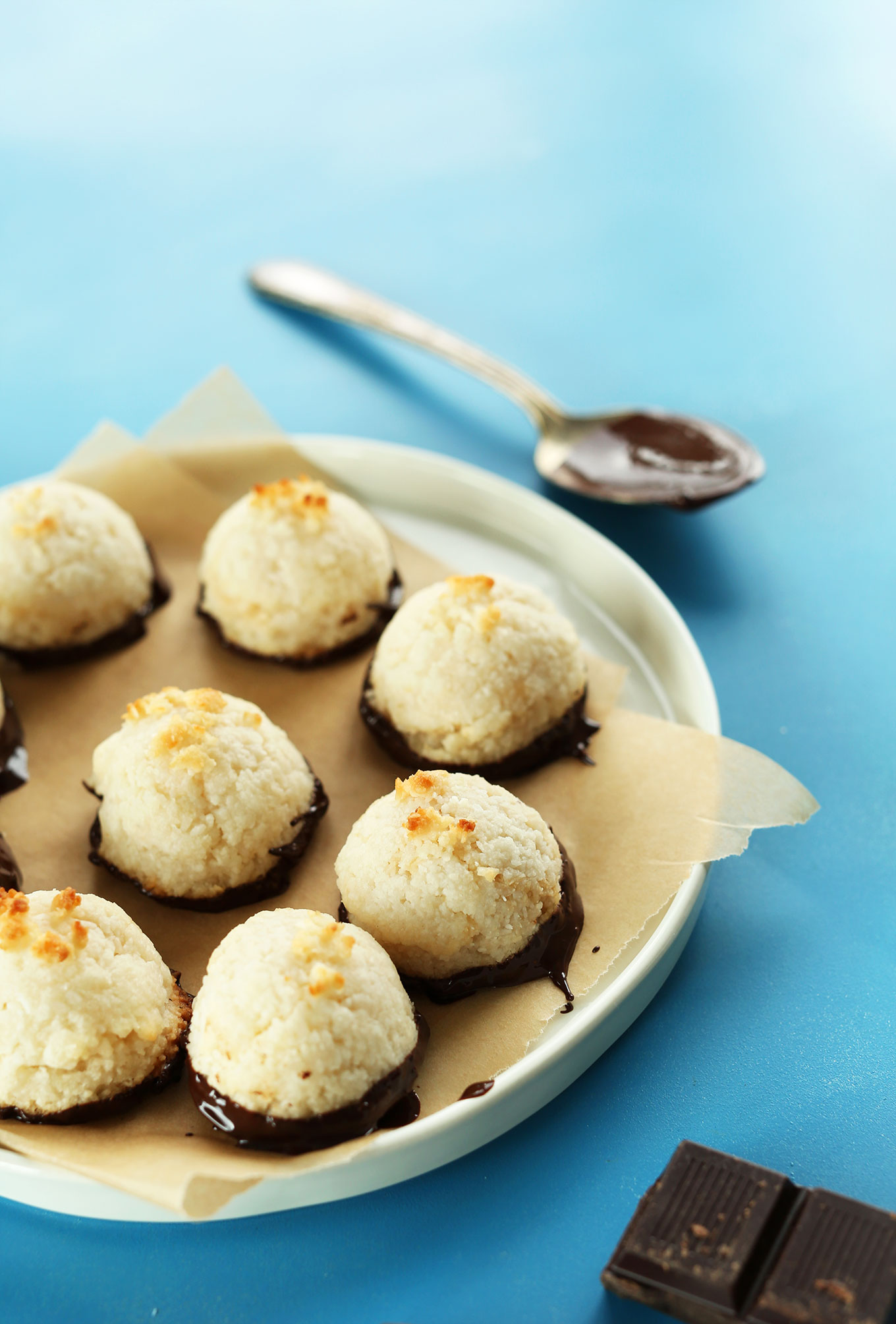 Plate of homemade gluten-free vegan Chocolate-Dipped Coconut Macaroons