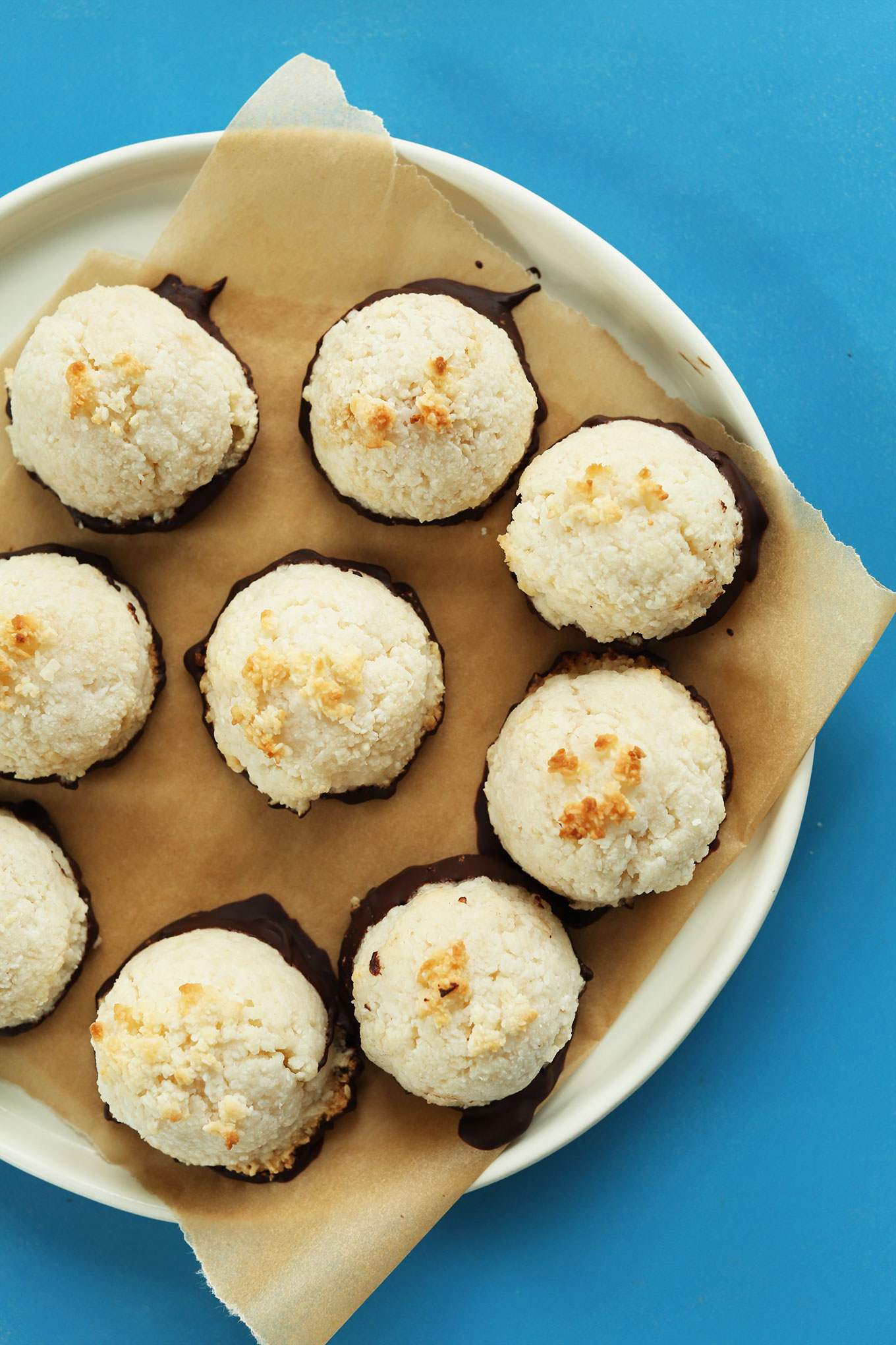 Plate of gluten-free vegan Dark-Chocolate Dipped Coconut Macaroons for dessert