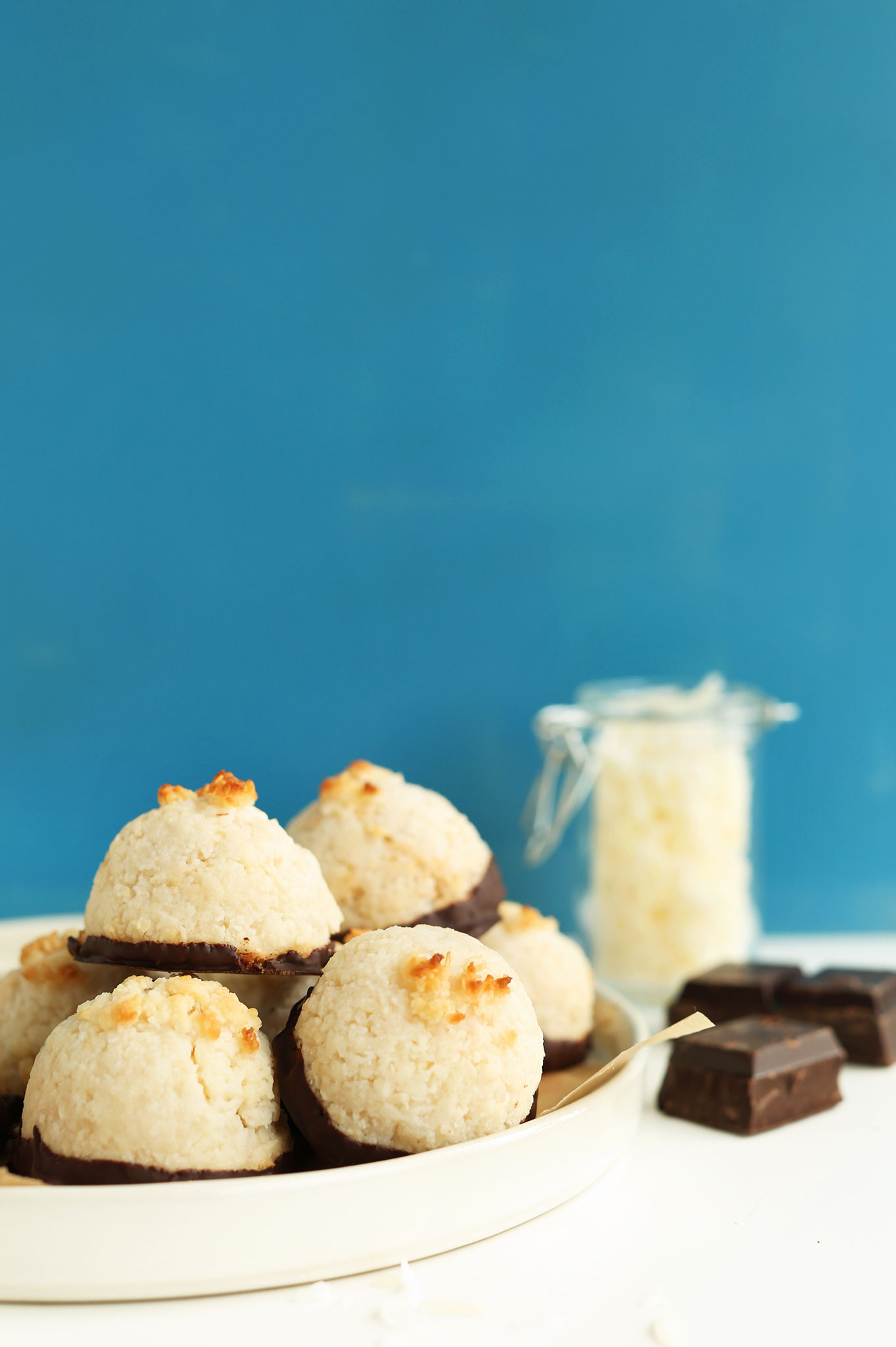 Plate of our Coconut Macaroons recipe dipped in dark chocolate