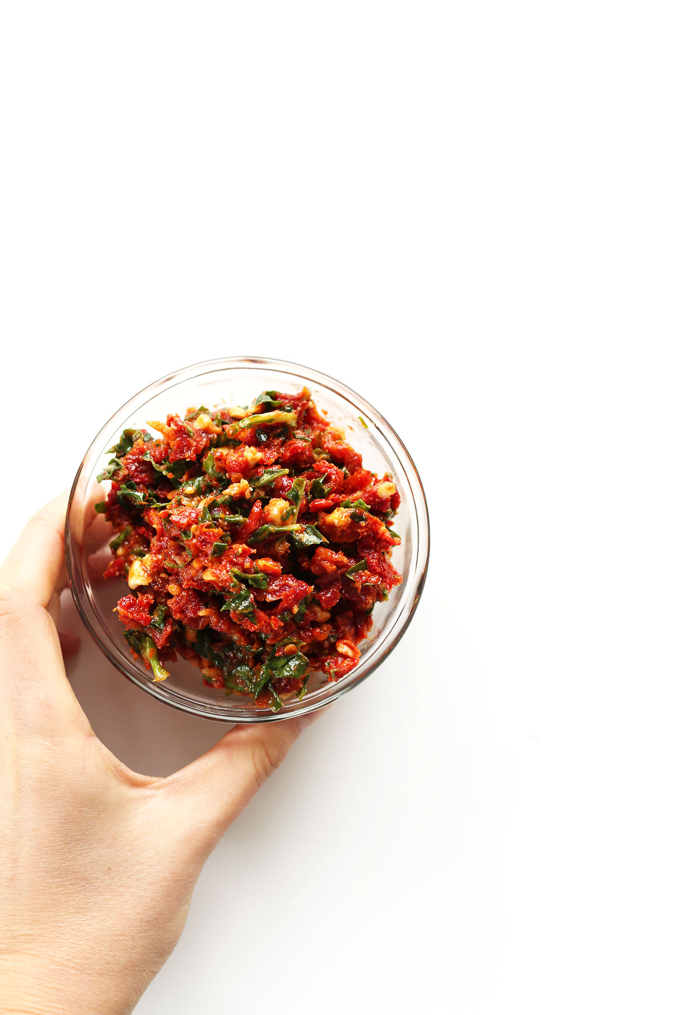 Small bowl filled with our simple Sun-Dried Tomato Pesto