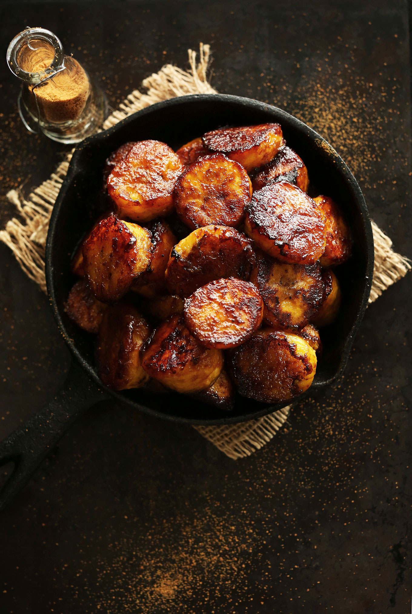 Cast-iron skillet filled with perfectly Caramelized Plantains