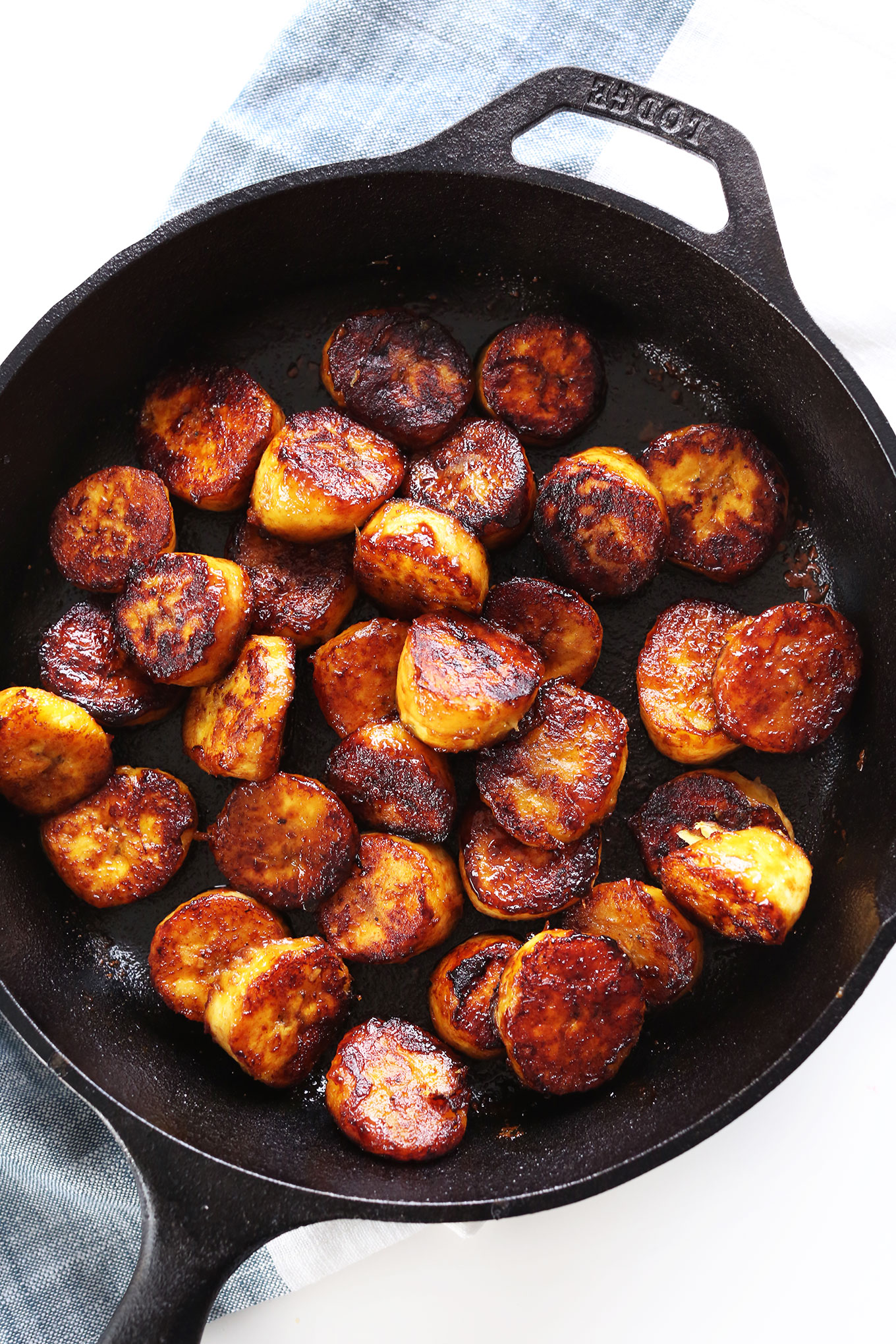 Skillet filled with 15-minute Coconut Sugar Caramelized Plantains
