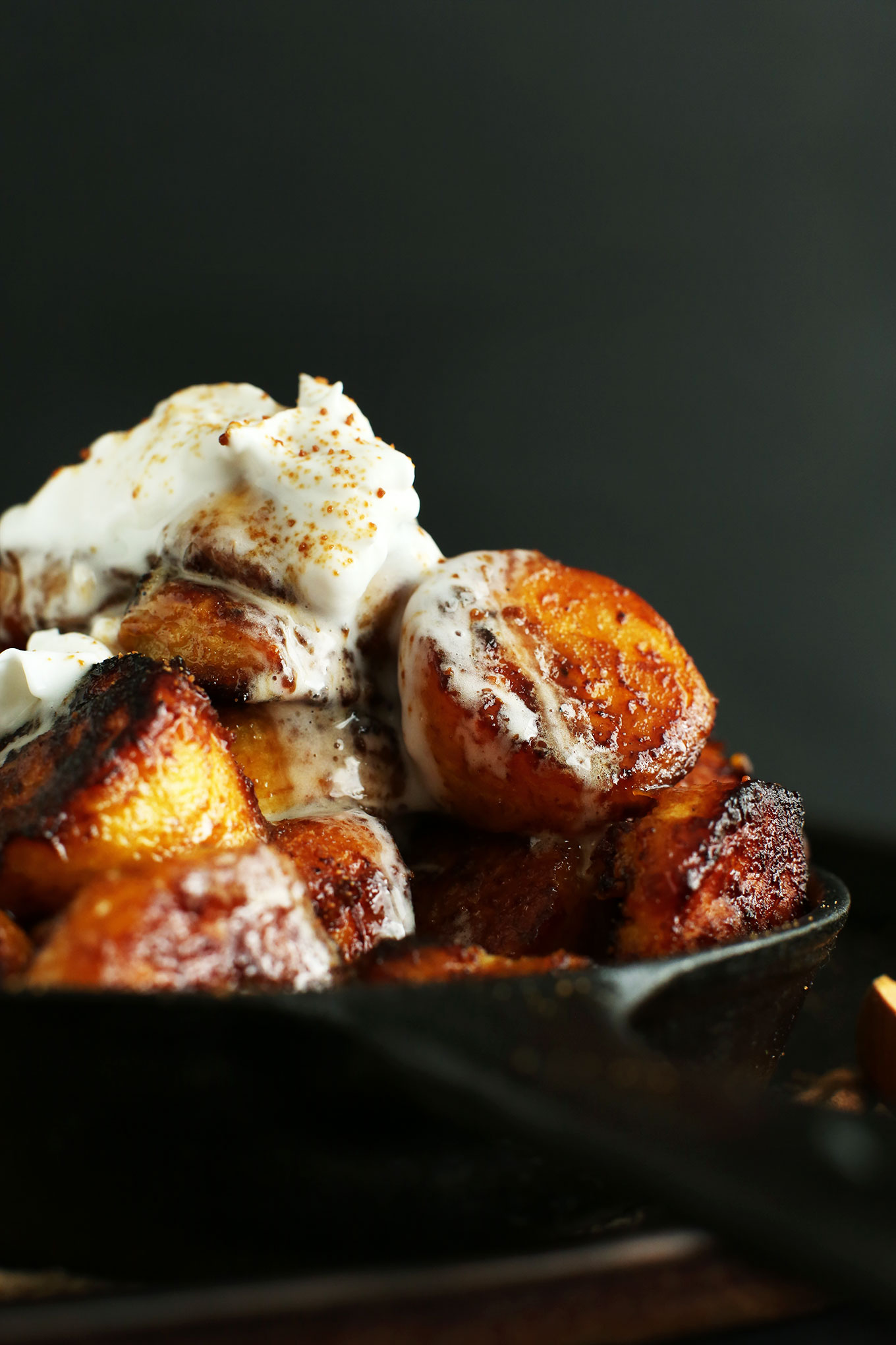 Cast-iron skillet filled with delicious vegan Caramelized Plantains