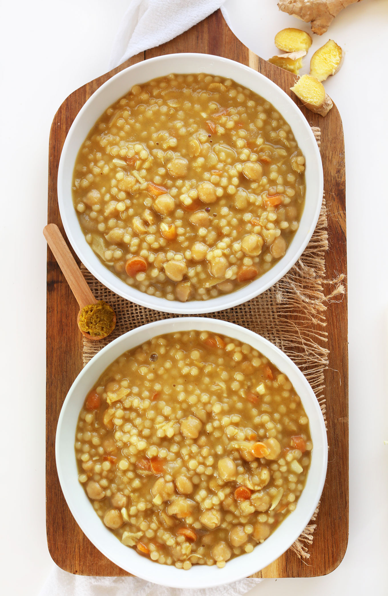 Bowls of Green Chickpea Curry with Israeli Couscous for a healthy vegan meal