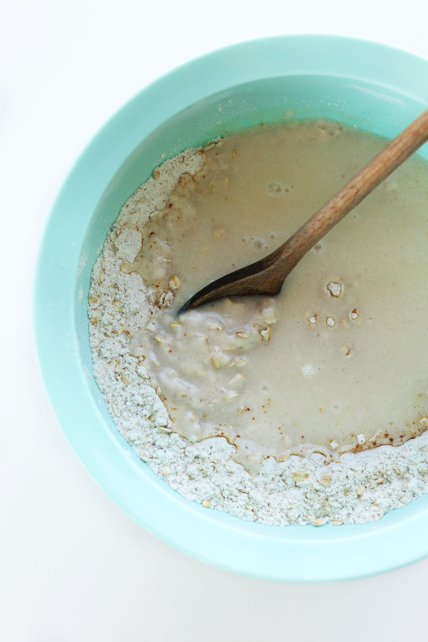 Mixing wet and dry ingredients together for homemade vegan gluten-free waffles