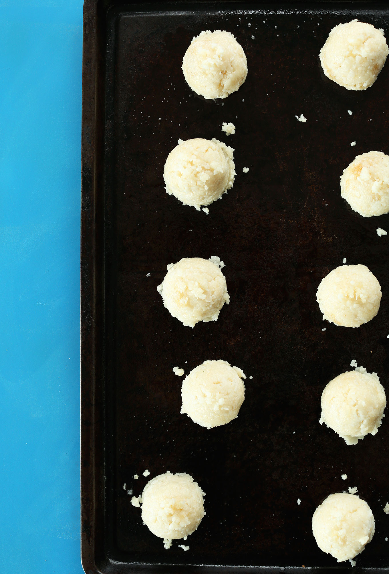 Baking sheet with homemade gluten-free vegan macaroons ready for baking