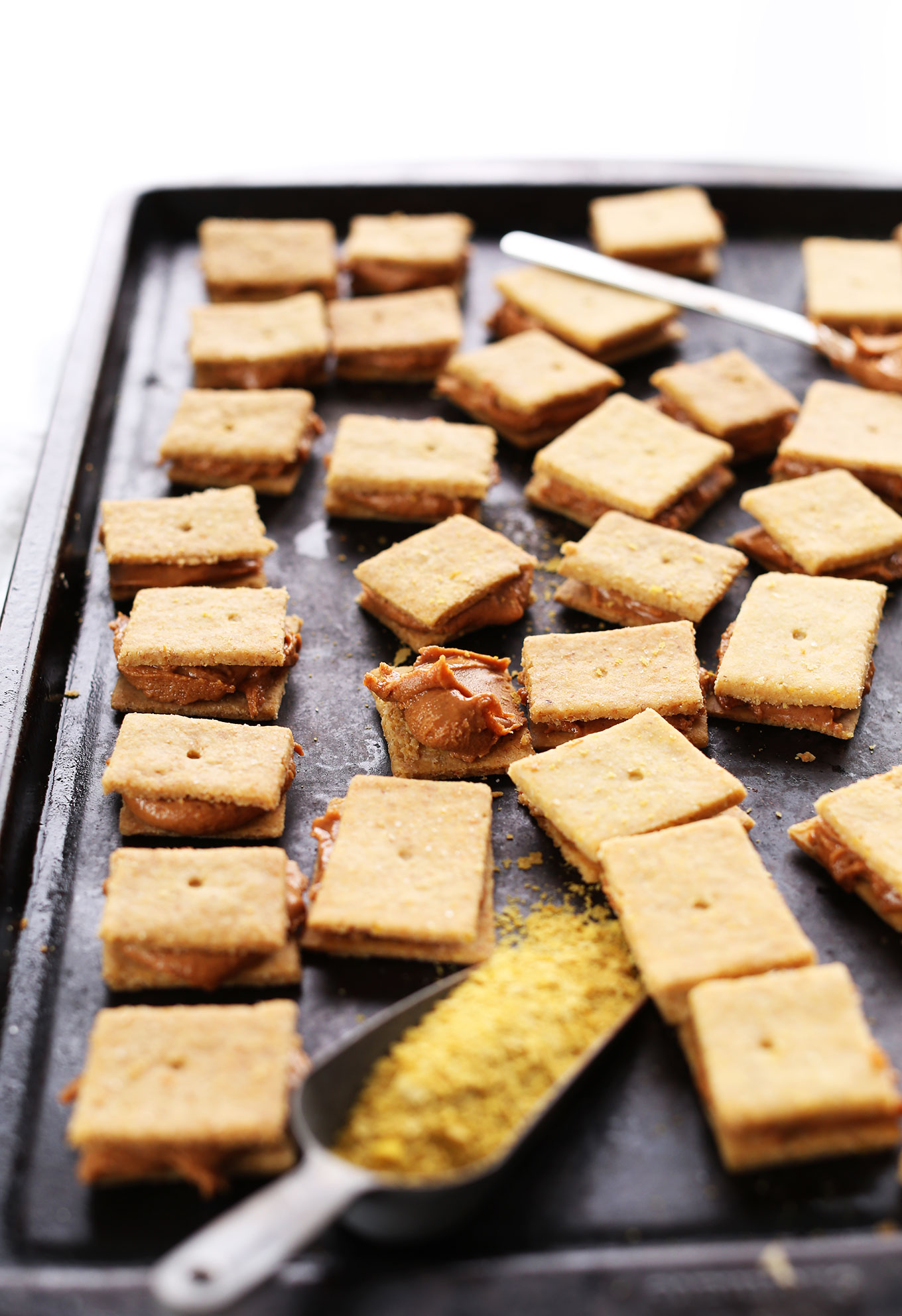 Baking sheet filled with homemade gluten-free vegan Peanut Butter Cheese Crackers