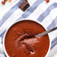 Naturally sweetened 4-ingredient nutella written above a bowl of homemade nutella