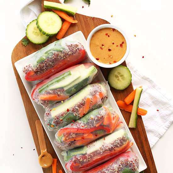 Platter of Quinoa Spring Rolls alongside a bowl of Cashew Dipping Sauce