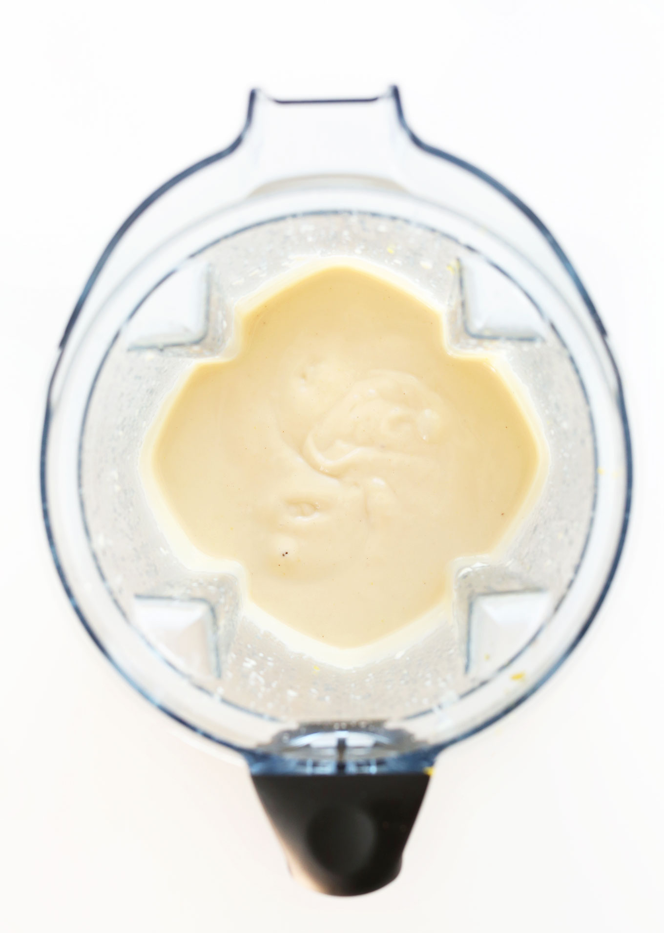 Blender with freshly blended vegan White Chocolate Lemon Cheesecake filling