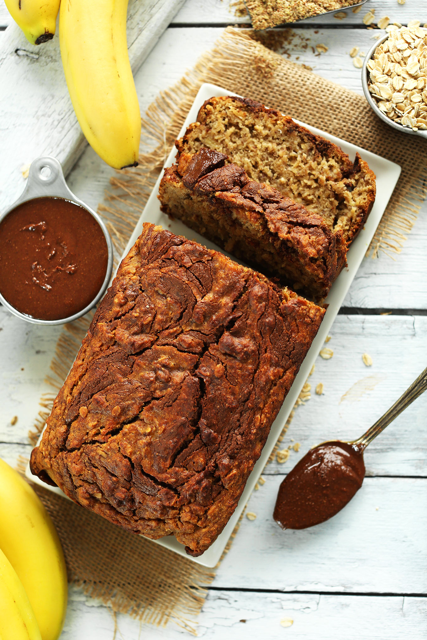 Plate of freshly sliced 1-Bowl Nutella Banana Bread for a gluten-free vegan dessert