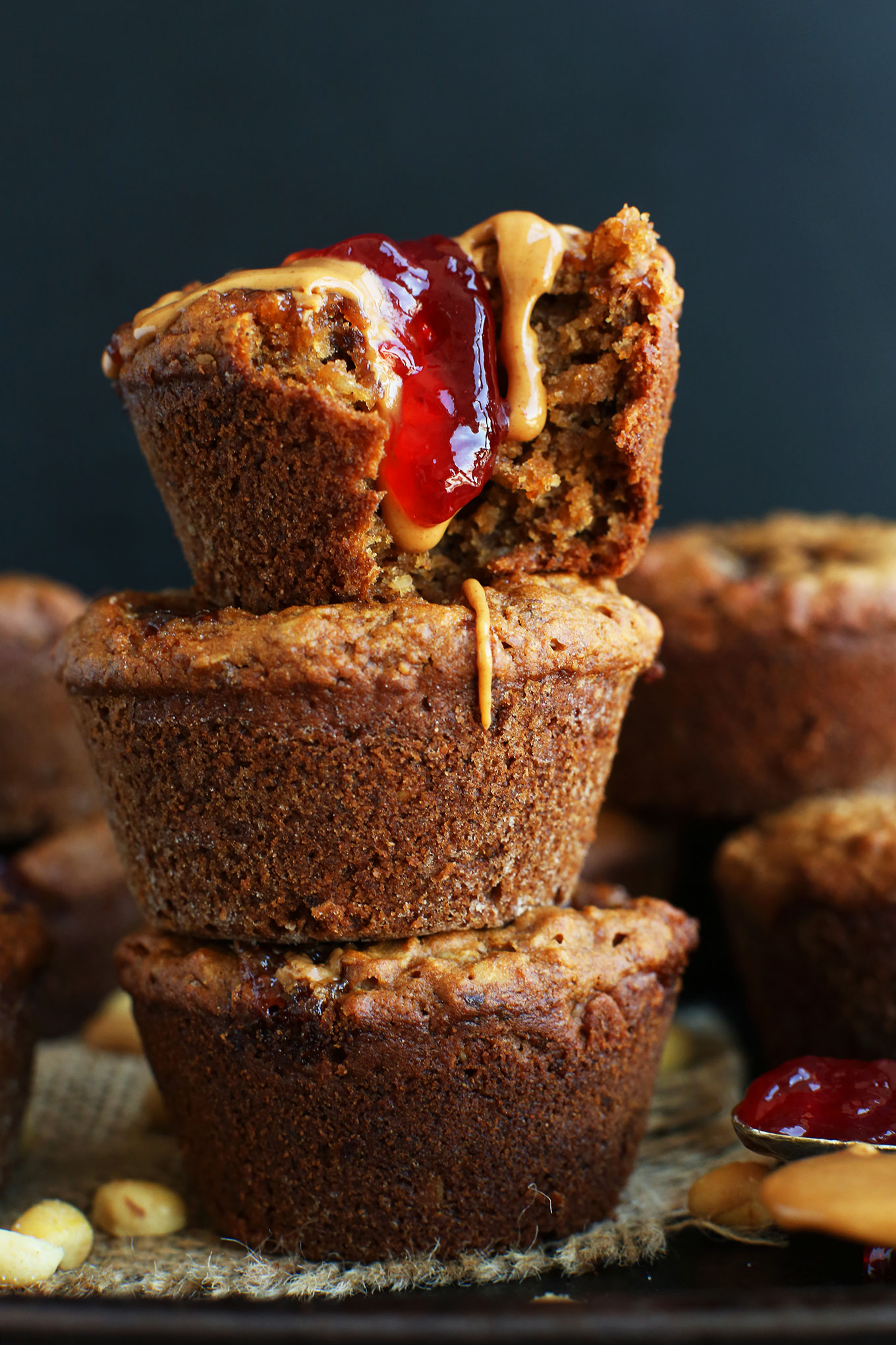 Close up shot of a muffin dripping with delicious peanut butter and helly