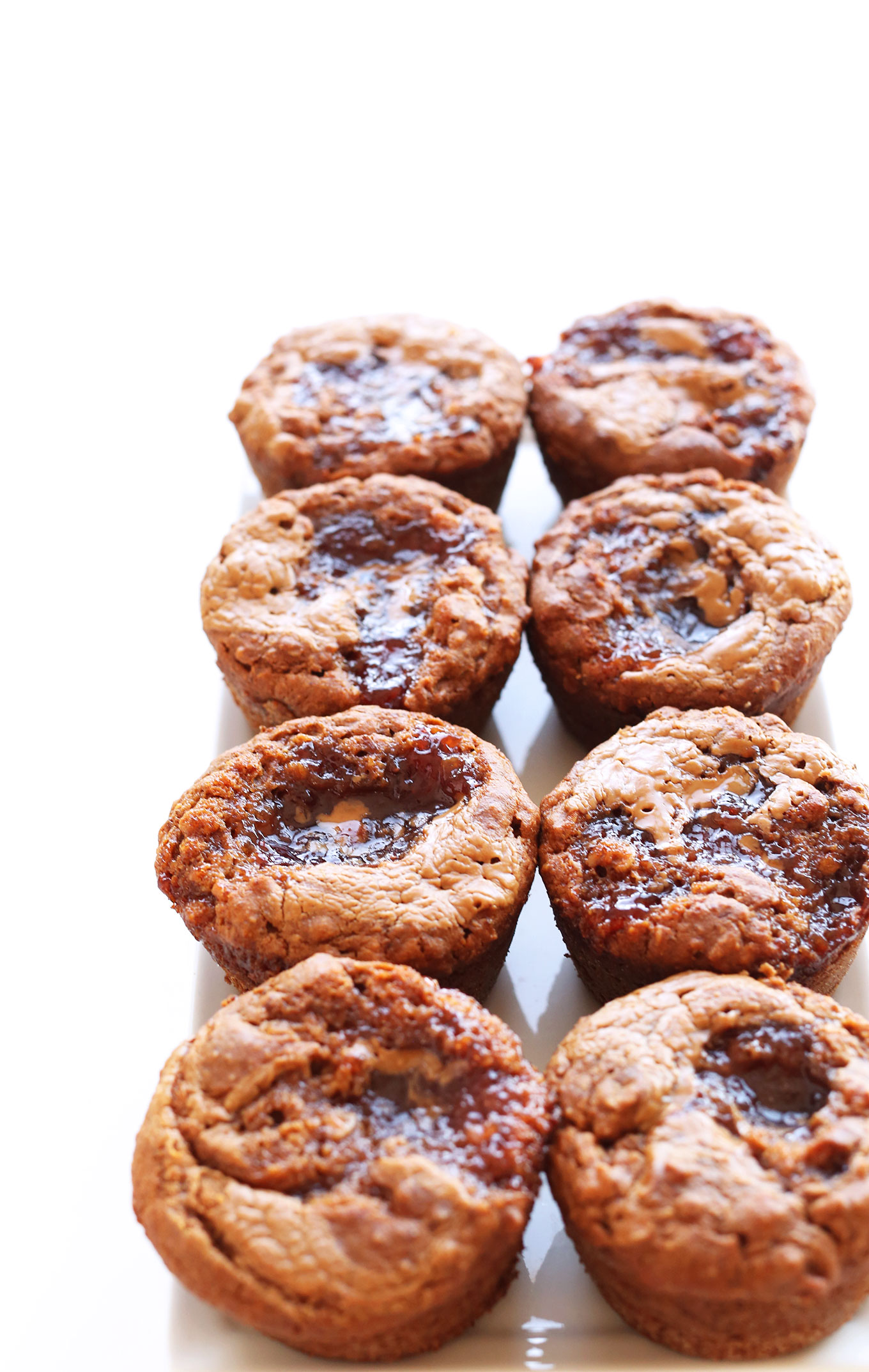 Plate of vegan, gluten-free, and naturally sweetened PB&J Muffins
