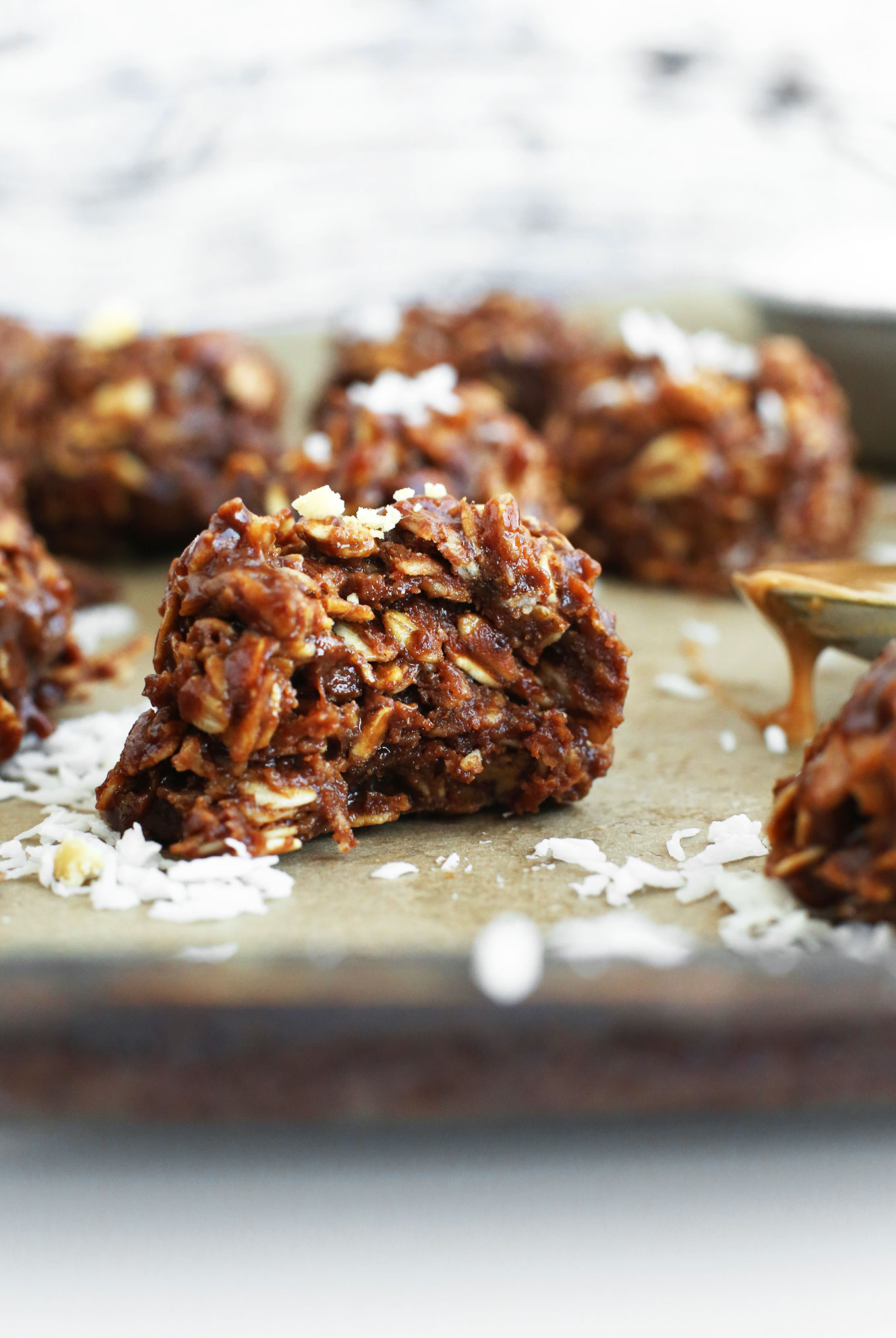Close up shot of a partially eaten Coconut No-Bake Cookie