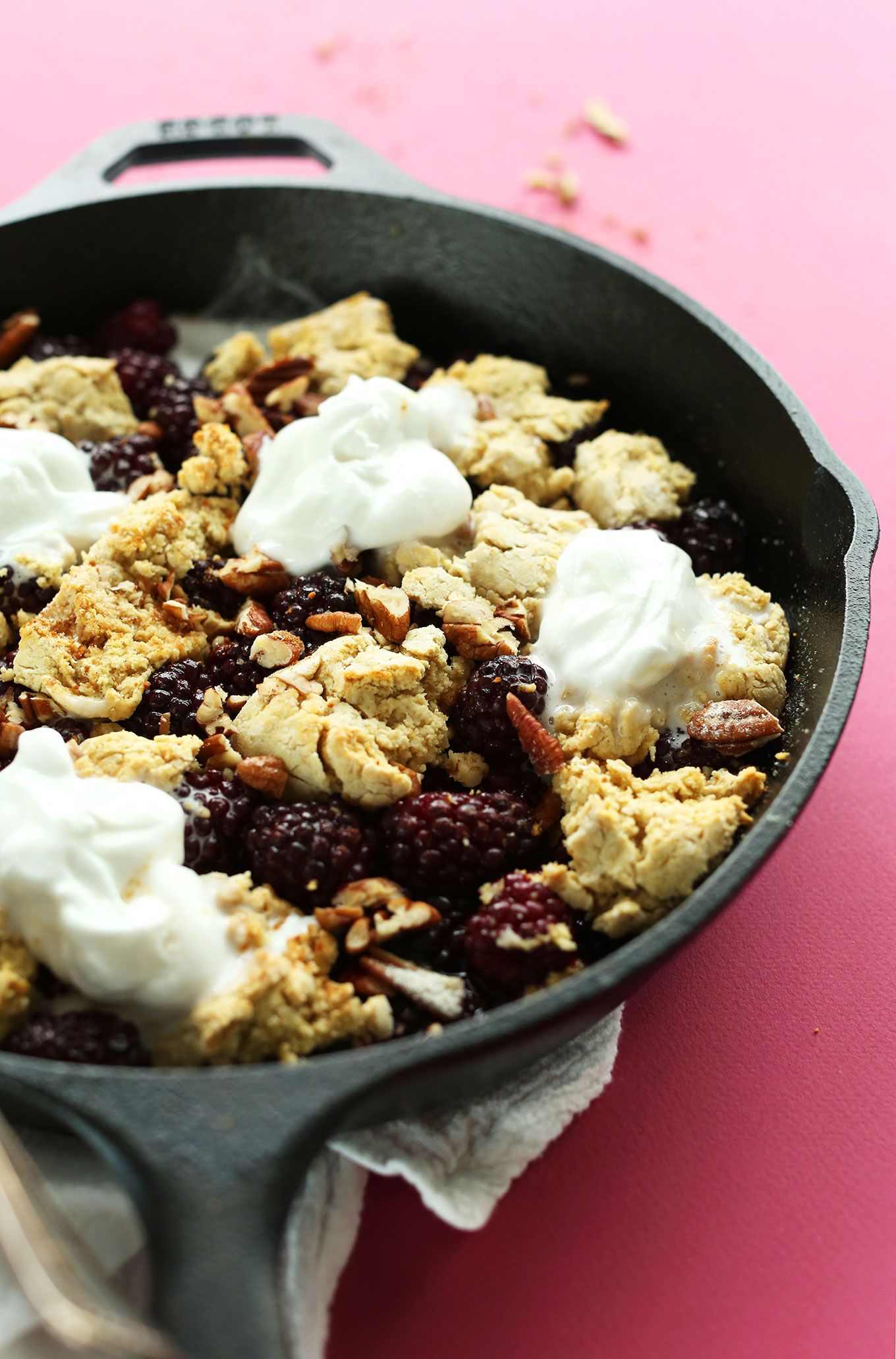 Cast-iron skillet with freshly baked gluten-free vegan Blackberry Cobbler