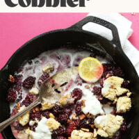 Overhead shot of a cast iron pan of blackberry cobbler