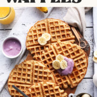 Vegan gluten-free coconut yogurt waffles on a wood board