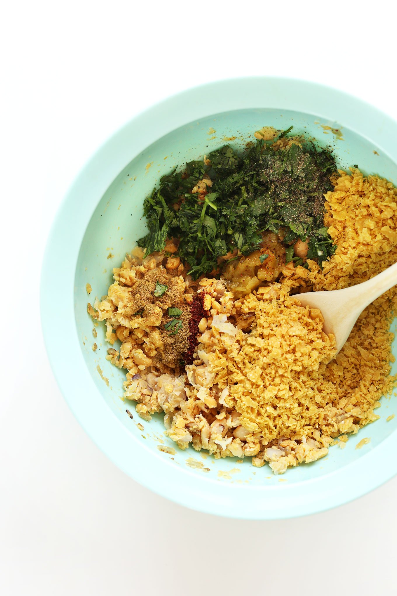 Mixing together ingredients for homemade gluten-free vegan Green Chili Veggie Burgers