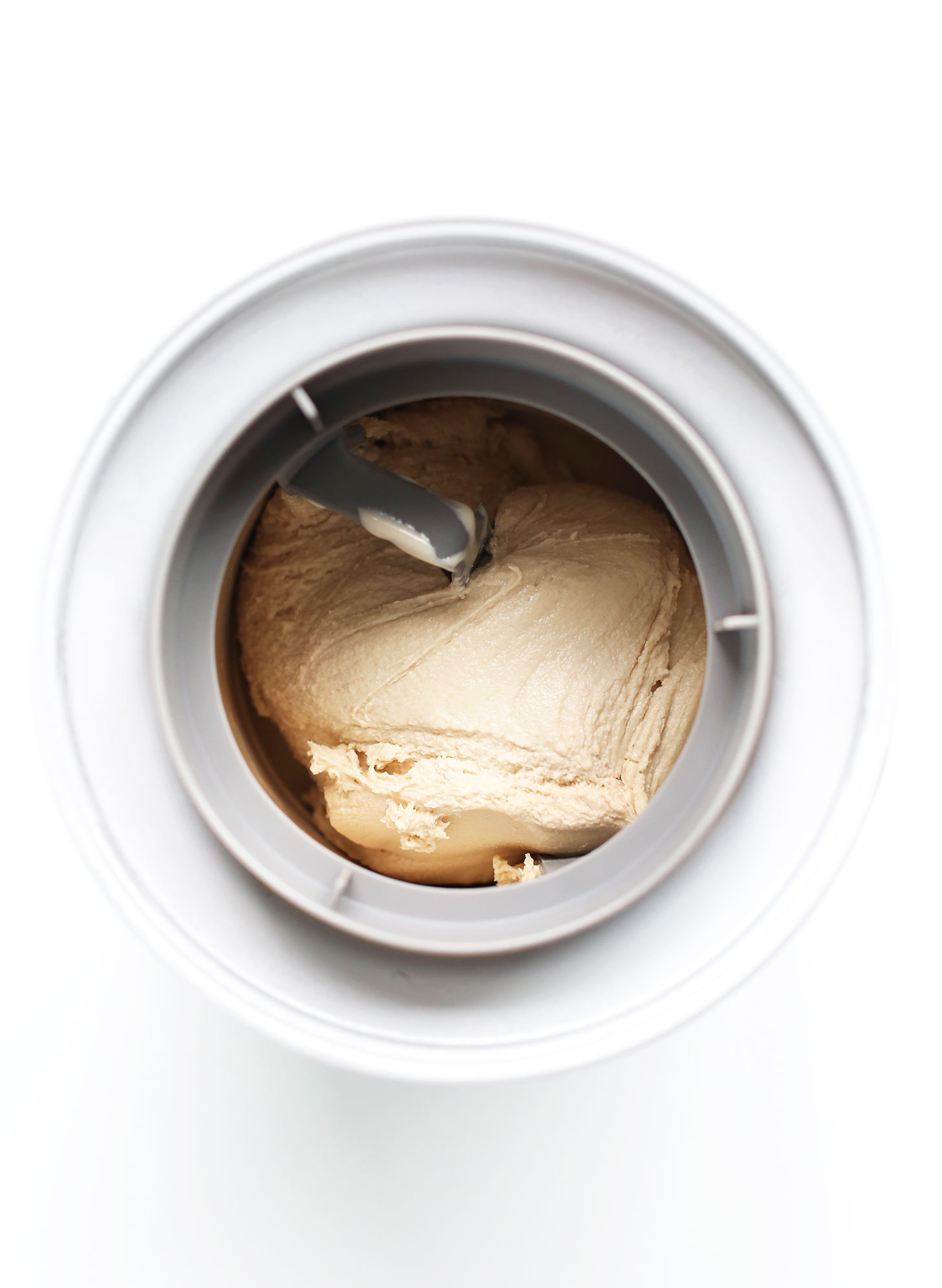 Churning homemade ice cream in an ice cream maker
