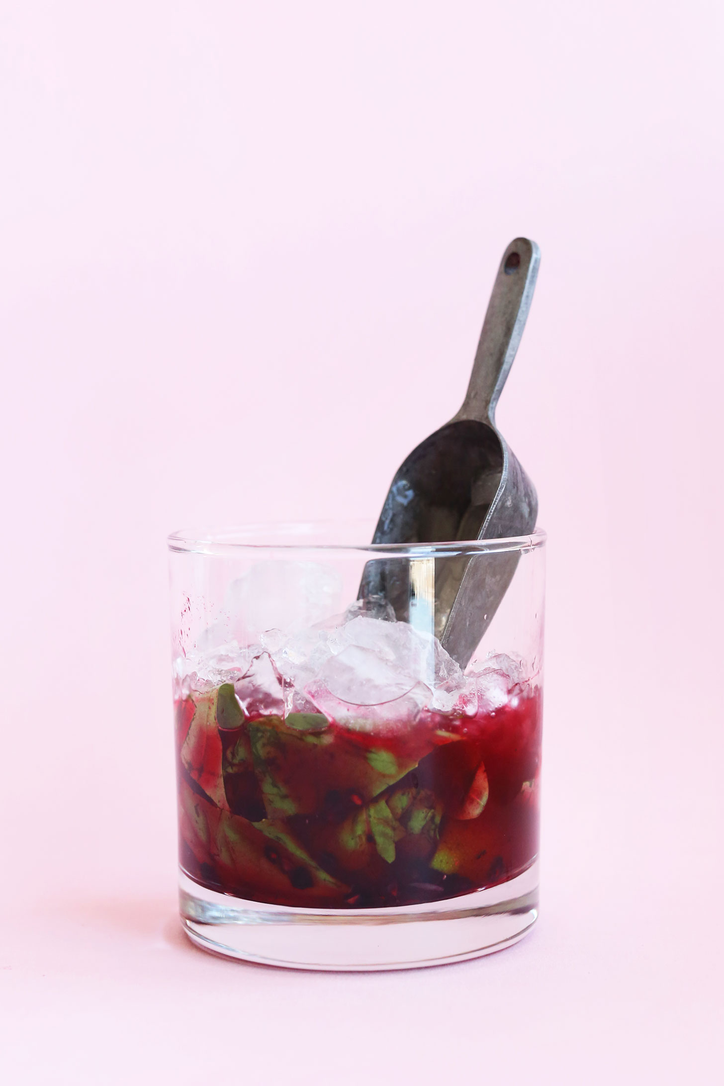 Adding ice to a vegan summery drink