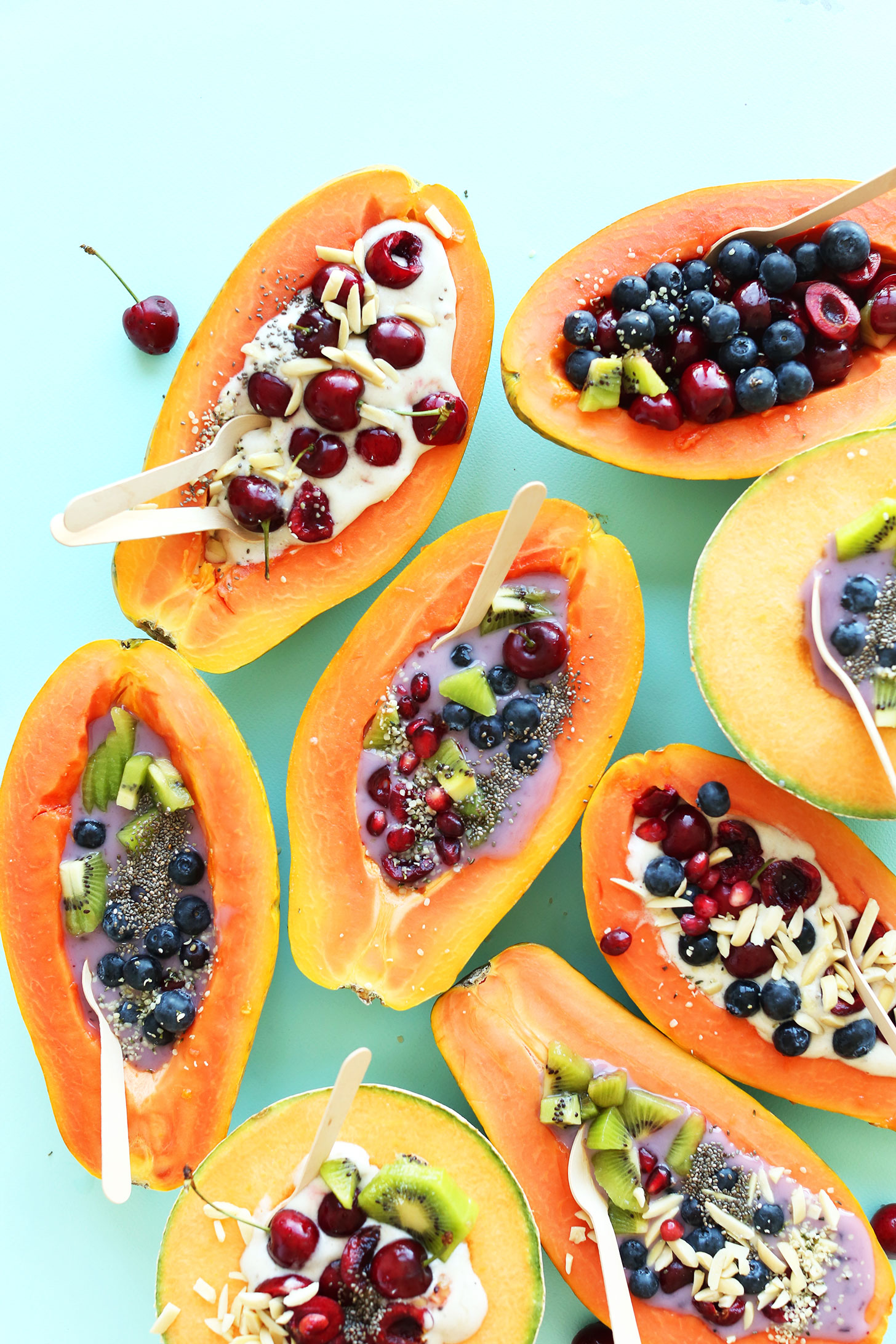 Papaya Boats filled with various toppings for a healthy gluten-free vegan snack