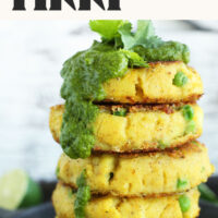 Stack of Aloo Tikki (Indian potato cakes) with green chutney dripping down the side