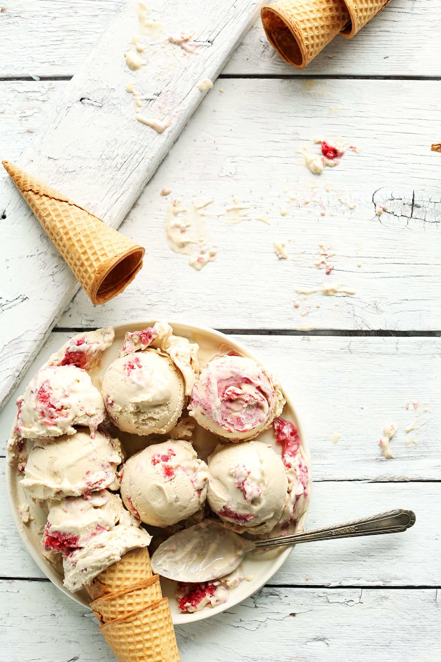 Plate filled with scoops of our tart and sweet Raspberry Ripple Coconut Ice Cream