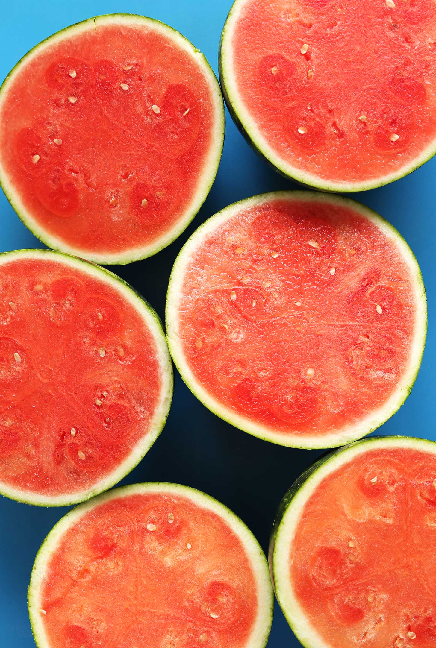 Halved watermelons for making a summer vegan smoothie recipe