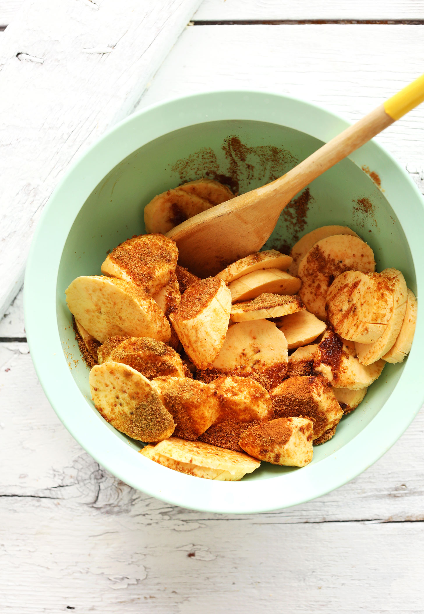 Tossing spiced plantains with tacos for making healthy Spicy Plantain Black Bean Tacos