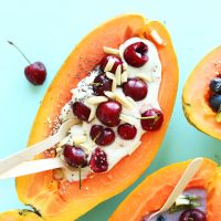 Fresh Papaya Boats loaded with toppings for a healthy summer breakfast