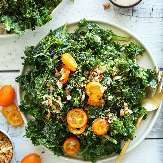 Big plate of Kale Kumquat Salad for a healthy vegan dinner