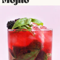 Glass of our homemade blackberry basil mojito cocktail