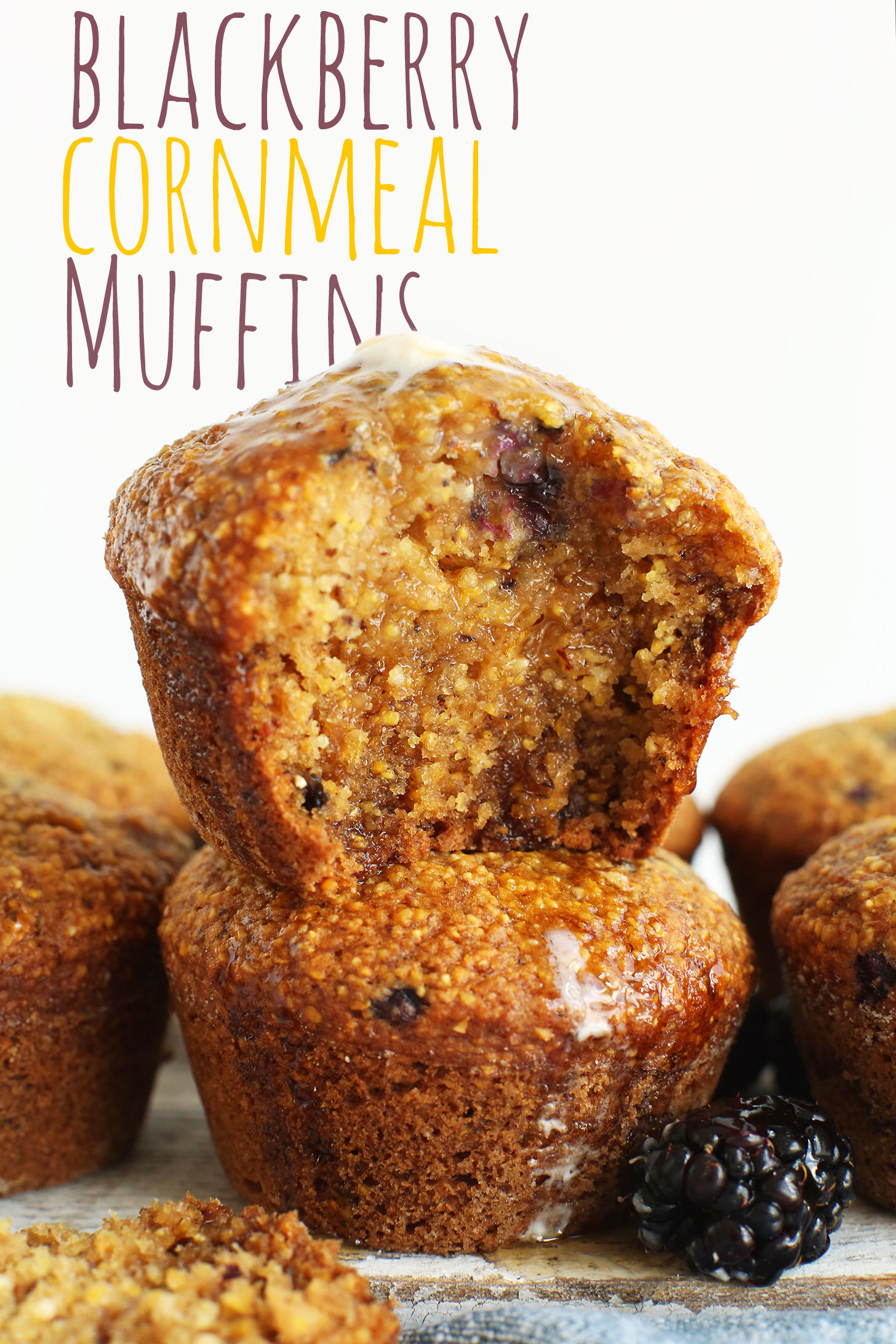 Stack of our simple and amazing vegan Blackberry Cornmeal Muffins