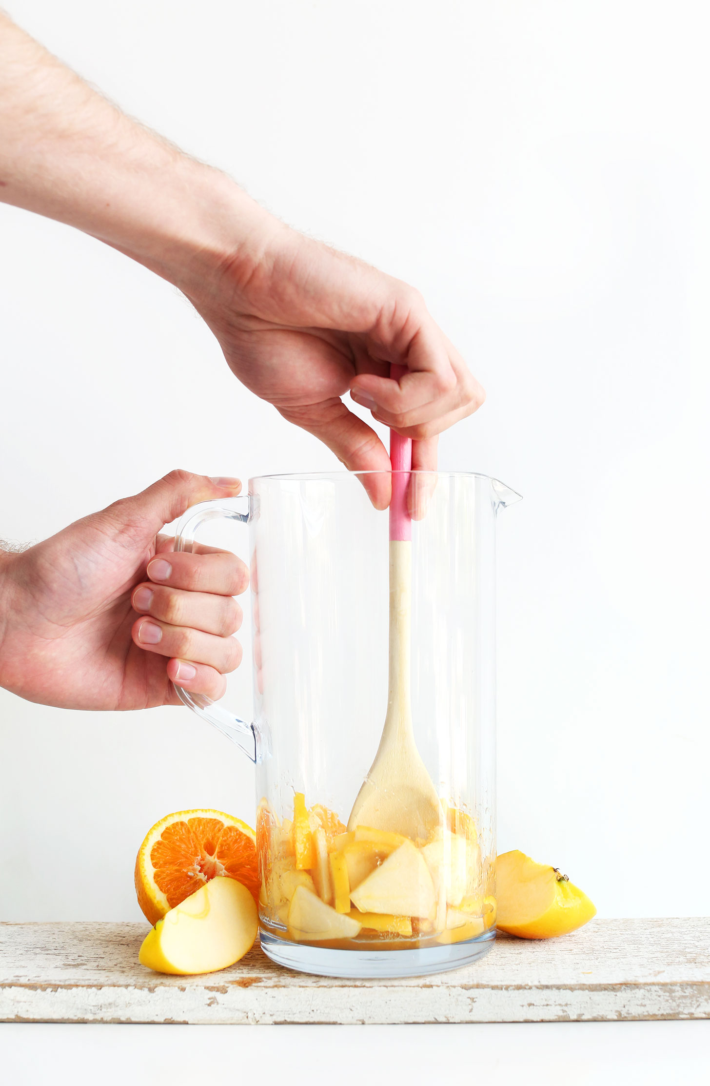 Stirring fruit for making homemade Traditional Sangria