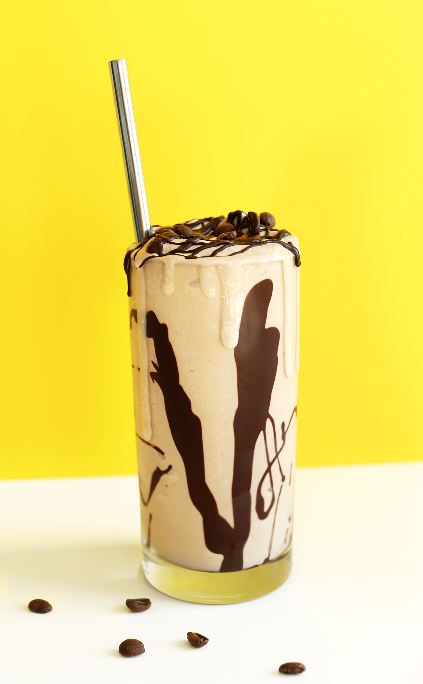 Large glass overflowing with our amazing Vegan Mocha Shake recipe