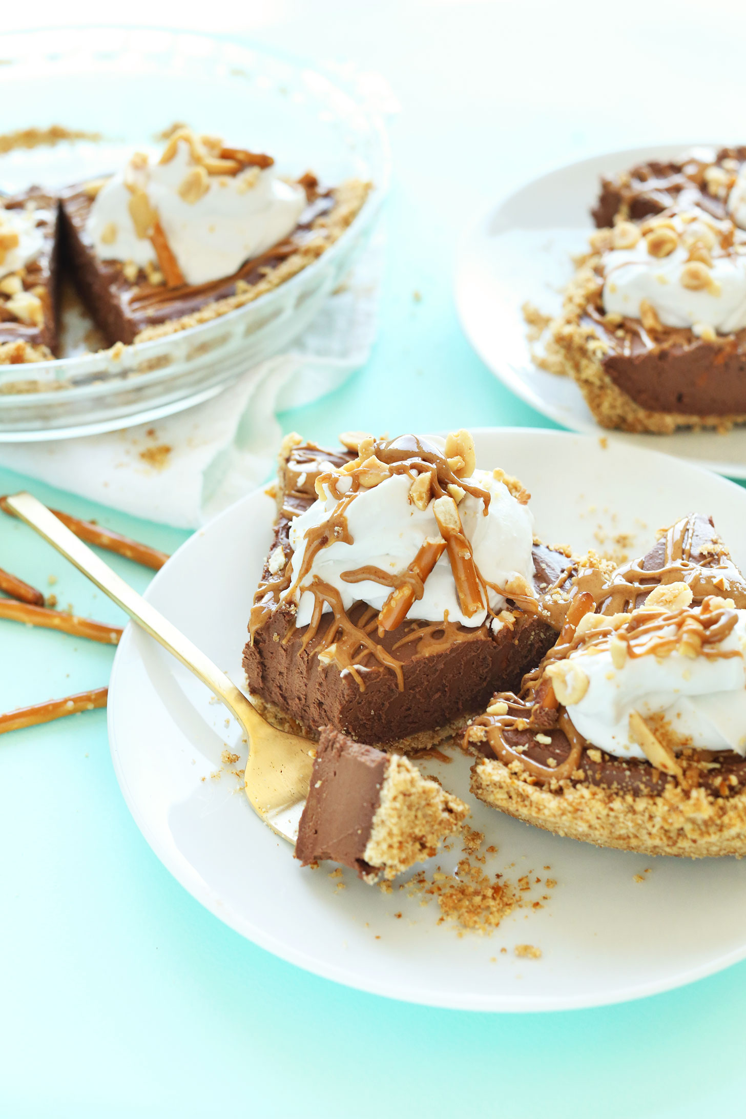 Using a fork to grab a bite of delicious Vegan Pretzel Peanut Butter Chocolate Pie