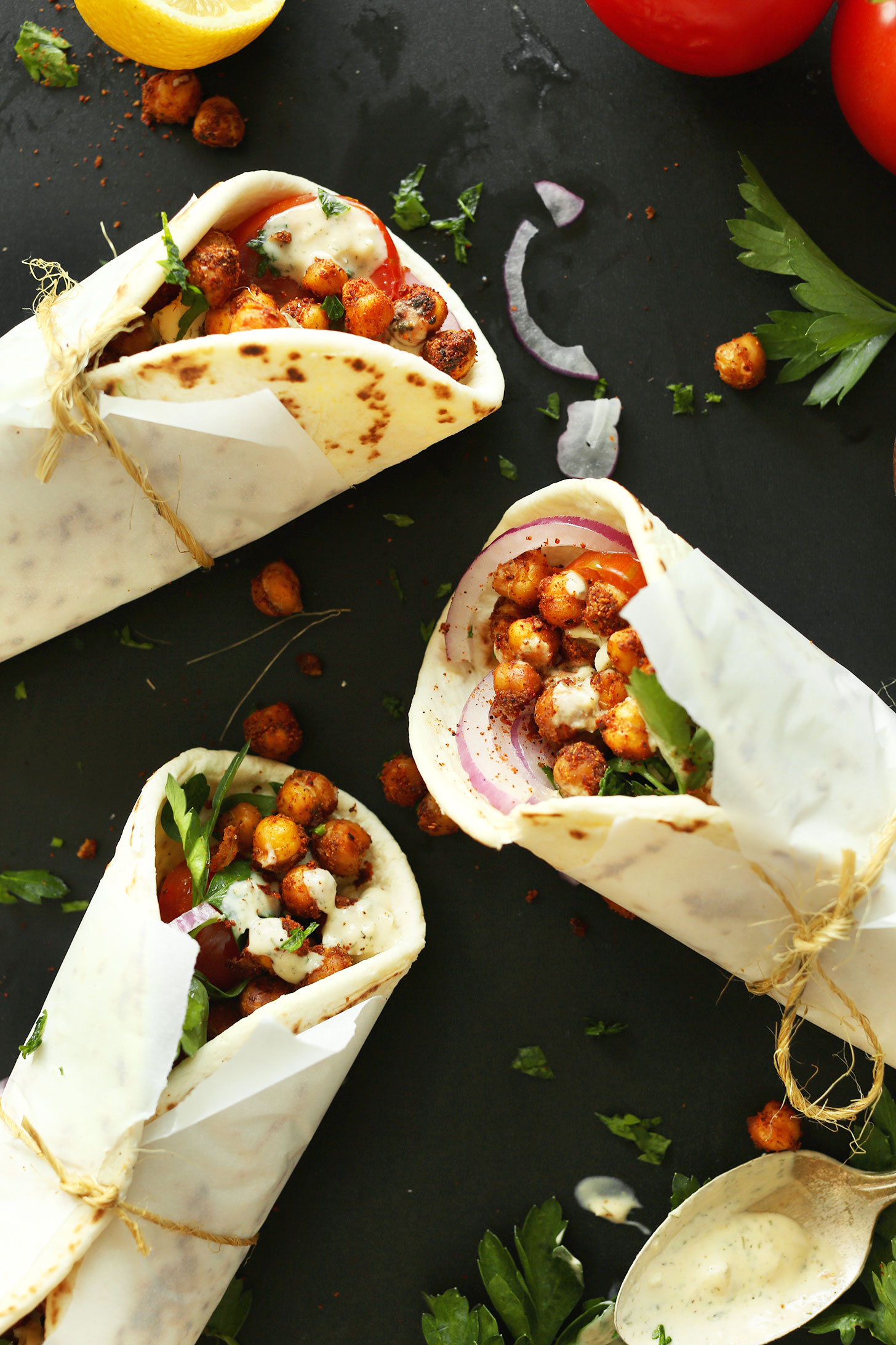 Healthy Chickpea Shawarma Wraps rolled in parchment paper and wrapped with twine